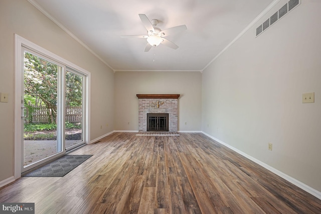 unfurnished living room with baseboards, ceiling fan, visible vents, and wood finished floors