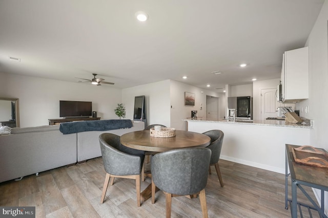 dining room featuring a ceiling fan, visible vents, recessed lighting, and light wood-style floors