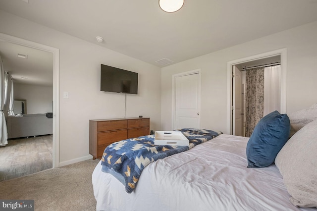 carpeted bedroom featuring baseboards