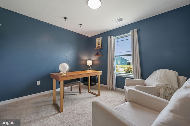 home office with visible vents, carpet flooring, and baseboards