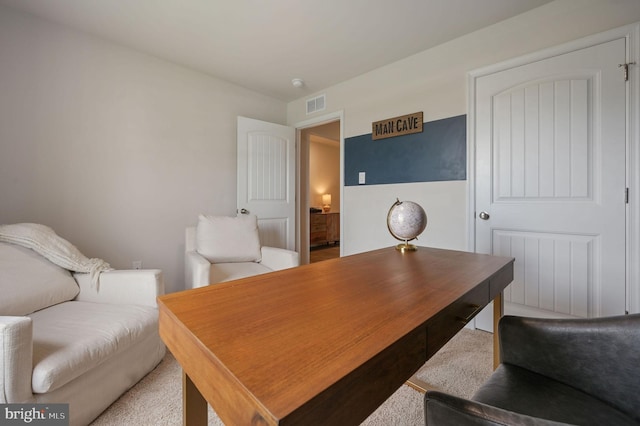 home office featuring visible vents and carpet flooring