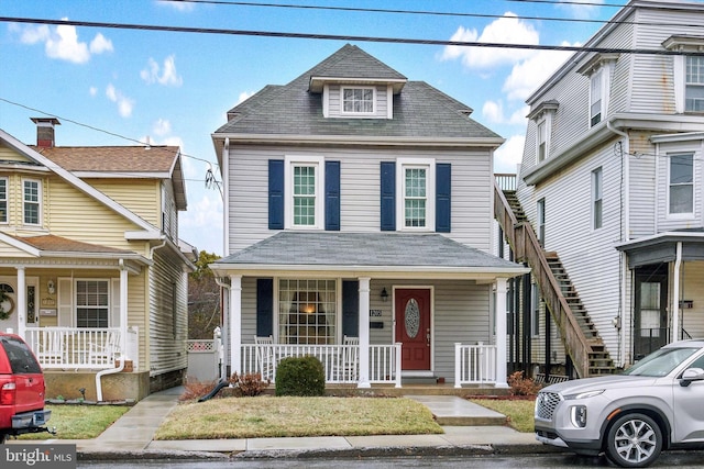 1205 Bridge St, New Cumberland, PA 17070 - american foursquare style home with a porch and roof with shingles
