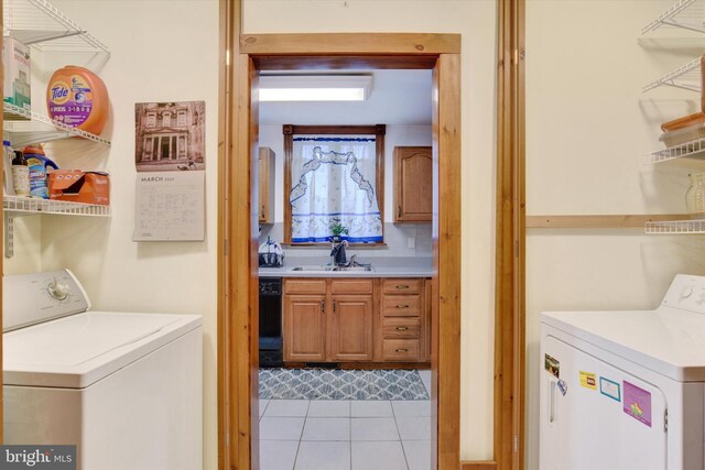 1205 Bridge St, New Cumberland, PA 17070 - clothes washing area with washer and dryer, laundry area, a sink, and light tile patterned floors