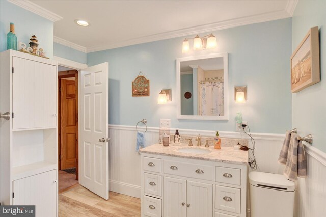 1205 Bridge St, New Cumberland, PA 17070 - full bath featuring a wainscoted wall, crown molding, toilet, wood finished floors, and vanity