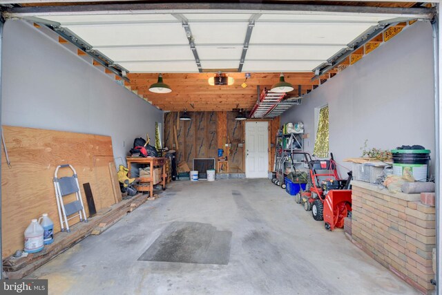 1205 Bridge St, New Cumberland, PA 17070 - garage featuring a garage door opener