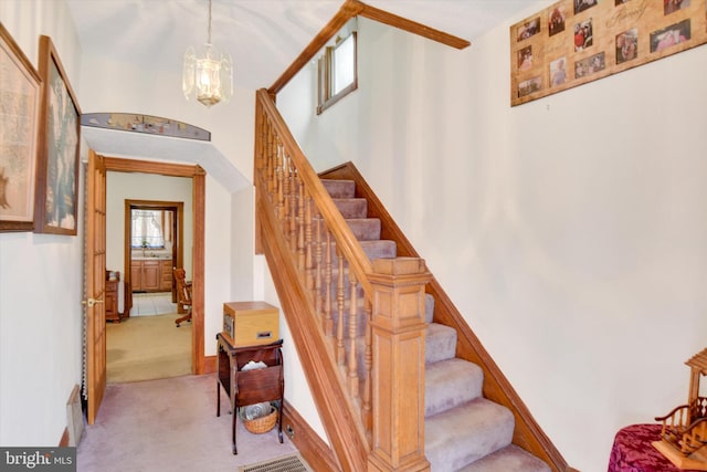 1205 Bridge St, New Cumberland, PA 17070 - staircase with baseboards, a notable chandelier, and carpet flooring