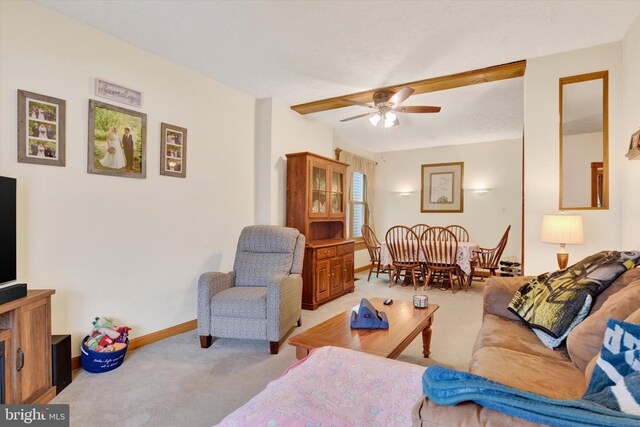 1205 Bridge St, New Cumberland, PA 17070 - living room featuring light carpet, baseboards, and ceiling fan
