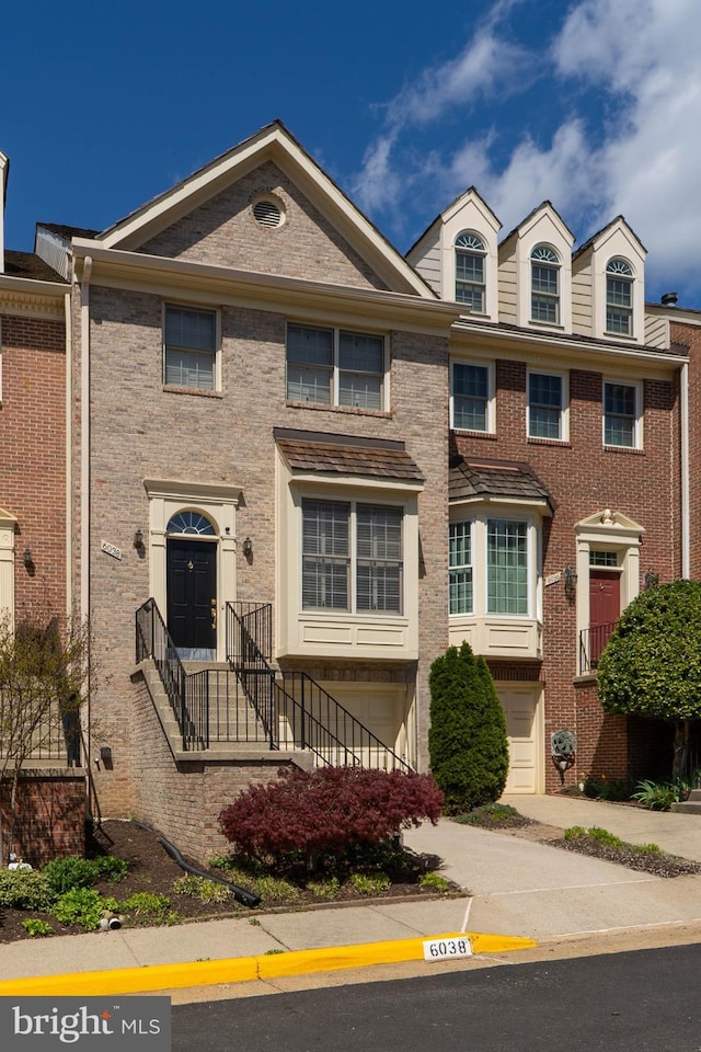 6038 Kelsey Ct, Falls Church, VA 22044 - multi unit property featuring a garage, brick siding, and driveway