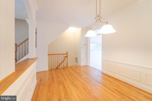 6038 Kelsey Ct, Falls Church, VA 22044 - interior space featuring visible vents, a decorative wall, crown molding, wood-type flooring, and a wainscoted wall