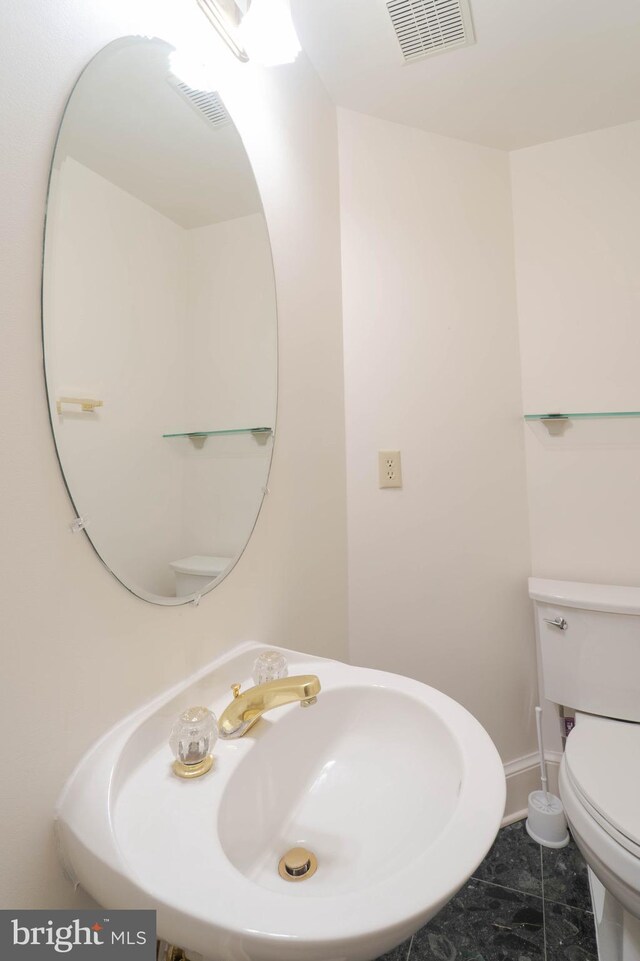 6038 Kelsey Ct, Falls Church, VA 22044 - half bathroom with visible vents, baseboards, a sink, and toilet
