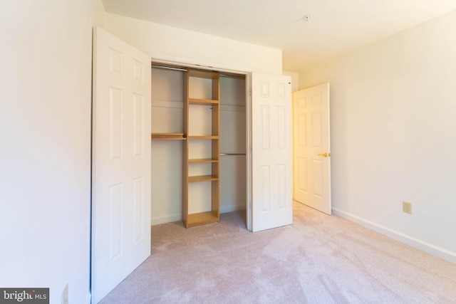 6038 Kelsey Ct, Falls Church, VA 22044 - unfurnished bedroom featuring a closet, baseboards, and light colored carpet