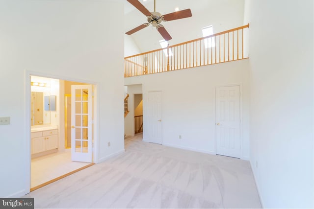 6038 Kelsey Ct, Falls Church, VA 22044 - unfurnished living room featuring ceiling fan, high vaulted ceiling, light carpet, and baseboards