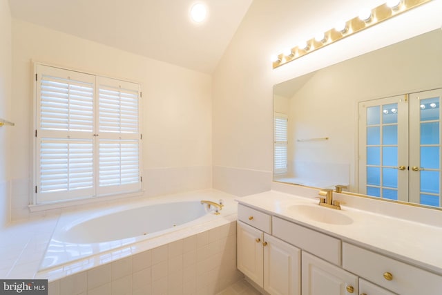6038 Kelsey Ct, Falls Church, VA 22044 - bathroom with french doors, vanity, a tub with jets, and lofted ceiling