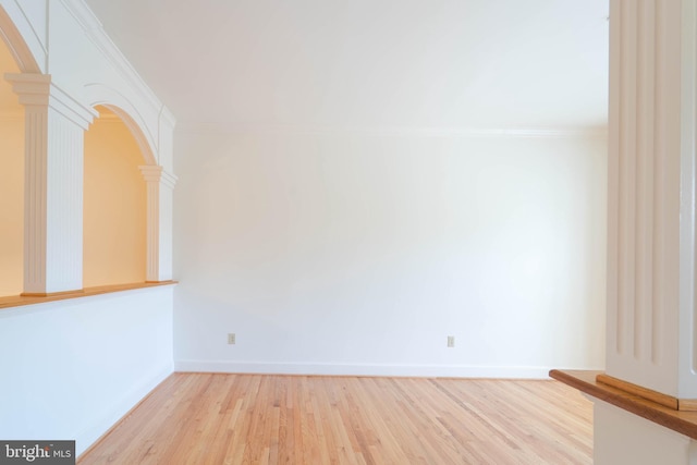 6038 Kelsey Ct, Falls Church, VA 22044 - unfurnished room featuring decorative columns, arched walkways, ornamental molding, light wood finished floors, and baseboards