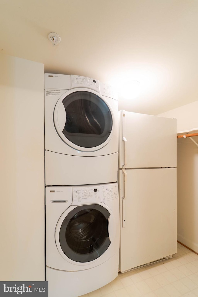 6038 Kelsey Ct, Falls Church, VA 22044 - clothes washing area featuring stacked washer and dryer and laundry area