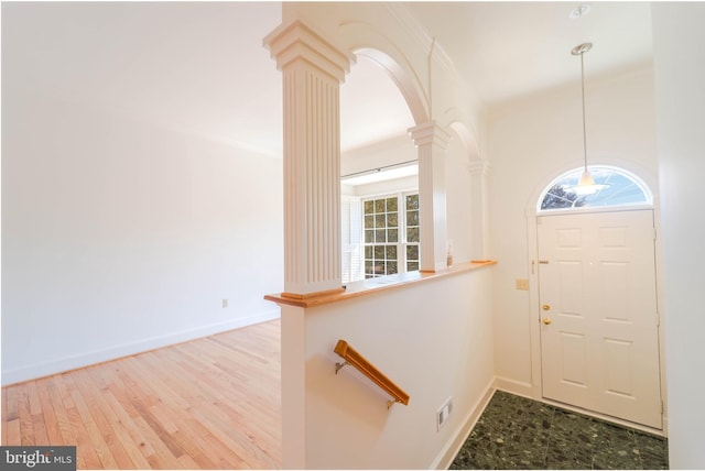 6038 Kelsey Ct, Falls Church, VA 22044 - foyer entrance with visible vents, baseboards, arched walkways, decorative columns, and wood finished floors