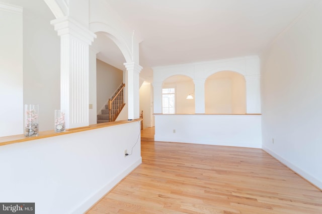 6038 Kelsey Ct, Falls Church, VA 22044 - empty room with crown molding, stairway, ornate columns, and wood finished floors