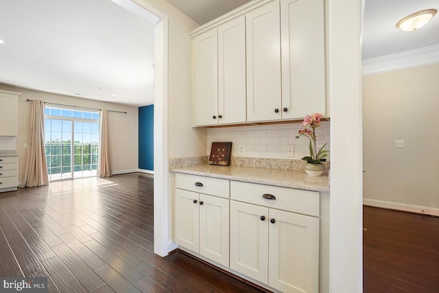 5919-2 Logans Way Unit 2, Ellicott City, MD 21043 - kitchen with dark wood-style floors, decorative backsplash, white cabinets, baseboards, and ornamental molding