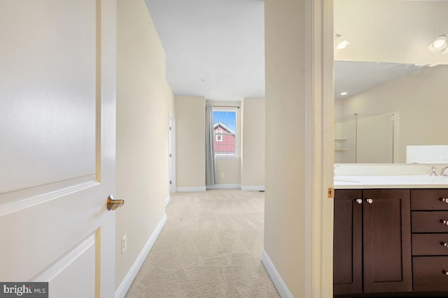 5919-2 Logans Way Unit 2, Ellicott City, MD 21043 - hall featuring light colored carpet, baseboards, and a sink