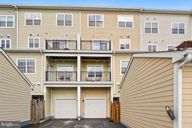 5919-2 Logans Way Unit 2, Ellicott City, MD 21043 - back of house featuring driveway, a balcony, a garage, and fence