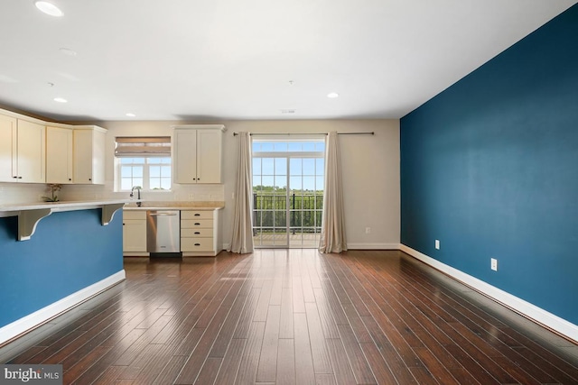 5919-2 Logans Way Unit 2, Ellicott City, MD 21043 - kitchen with dishwasher, a breakfast bar, light countertops, baseboards, and tasteful backsplash