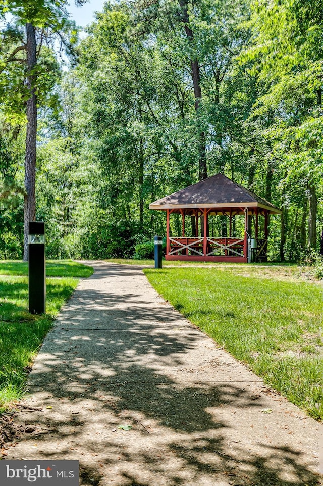 6 Finchley Ct, Southampton, NJ 08088 - view of community featuring driveway, a forest view, and a lawn