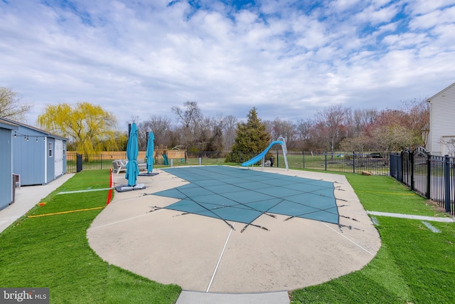 view of pool with a water slide