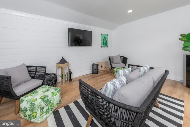 living area featuring baseboards, wood finished floors, recessed lighting, and lofted ceiling