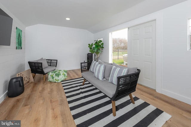 living area with wood finished floors and baseboards
