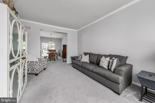 carpeted living room with ornamental molding and baseboards