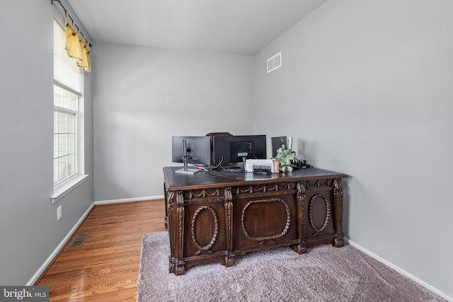 office with baseboards and wood finished floors