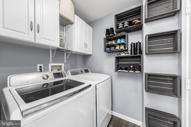 washroom with separate washer and dryer, dark wood-style floors, baseboards, and cabinet space