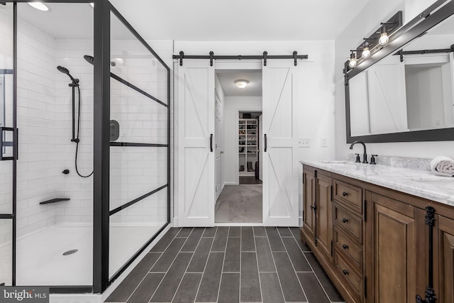 full bath with a stall shower and double vanity