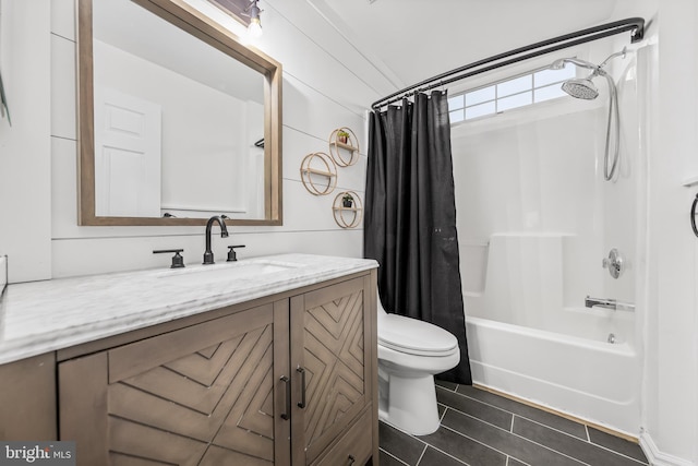 bathroom with toilet, shower / bath combination with curtain, vanity, and tile patterned floors