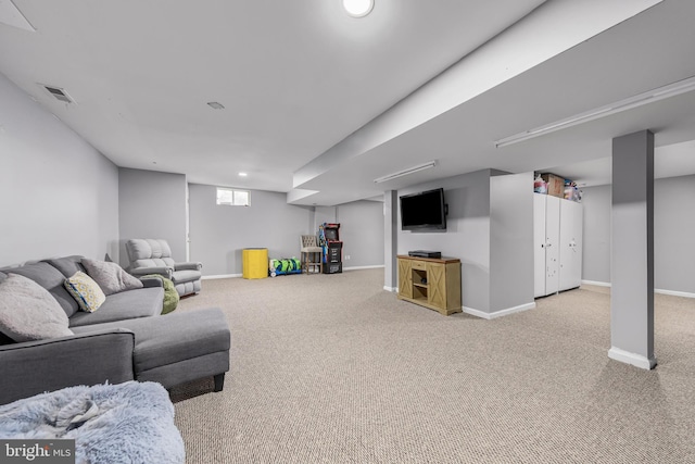 carpeted living area with baseboards
