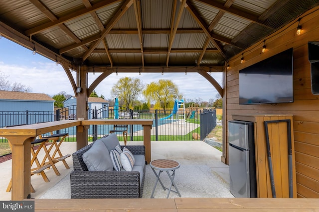view of patio / terrace with a gazebo and fence