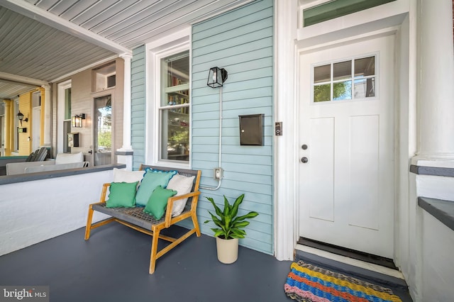 doorway to property with a porch