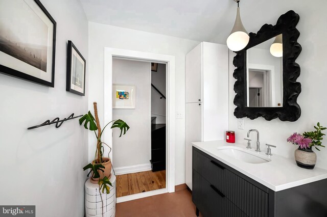 bathroom featuring vanity and baseboards