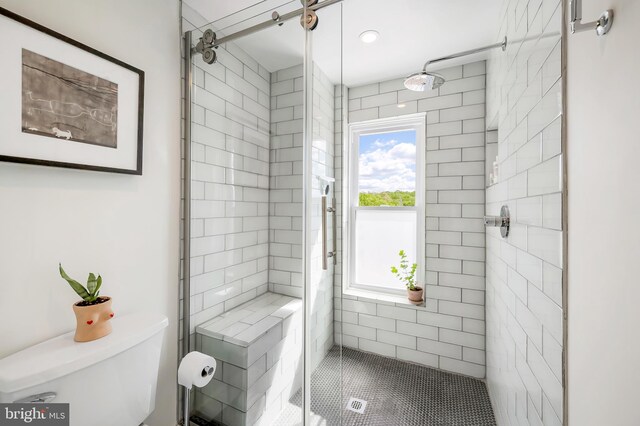 bathroom featuring a shower stall, plenty of natural light, and recessed lighting