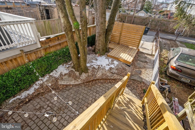 view of yard with fence and a wooden deck