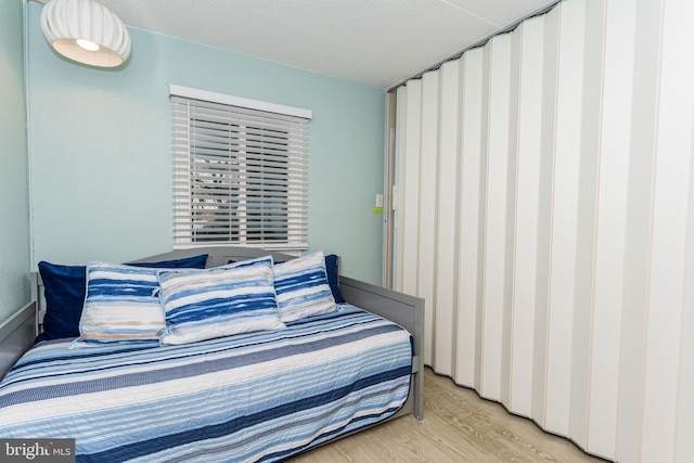11500 Coastal Hwy Unit 317, Ocean City, MD 21842 - bedroom with light wood-style flooring