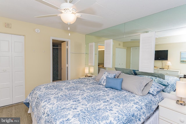 11500 Coastal Hwy Unit 317, Ocean City, MD 21842 - bedroom featuring wood finished floors, a closet, a ceiling fan, and visible vents