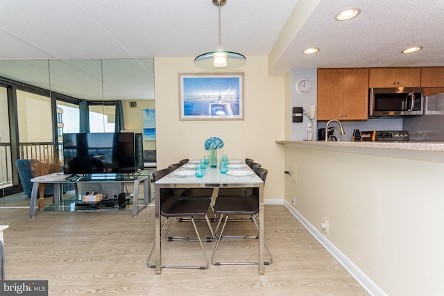 11500 Coastal Hwy Unit 317, Ocean City, MD 21842 - dining area featuring recessed lighting, light wood finished floors, and baseboards