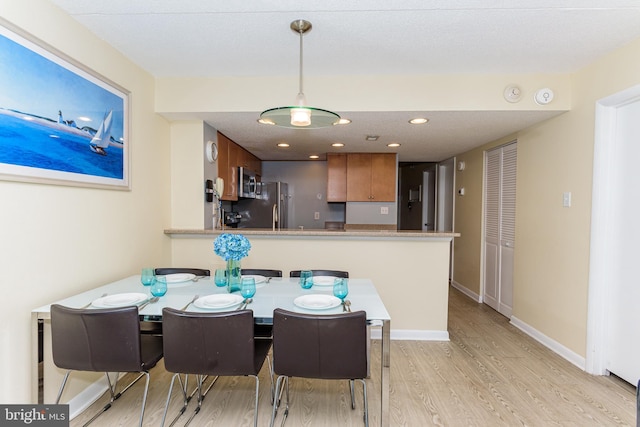 11500 Coastal Hwy Unit 317, Ocean City, MD 21842 - dining space with light wood-style flooring, baseboards, and recessed lighting