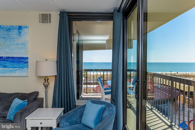 11500 Coastal Hwy Unit 317, Ocean City, MD 21842 - balcony with a water view, visible vents, and a beach view