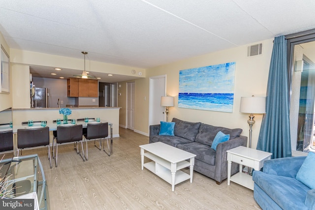 11500 Coastal Hwy Unit 317, Ocean City, MD 21842 - living room featuring light wood-style floors, baseboards, and visible vents
