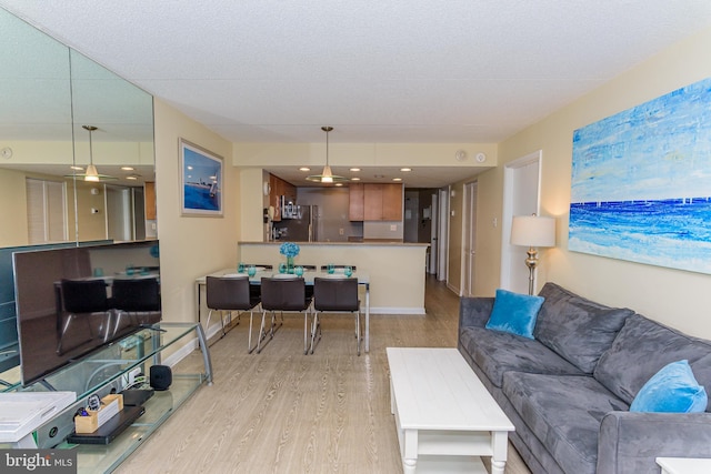 11500 Coastal Hwy Unit 317, Ocean City, MD 21842 - living room featuring wood finished floors and baseboards