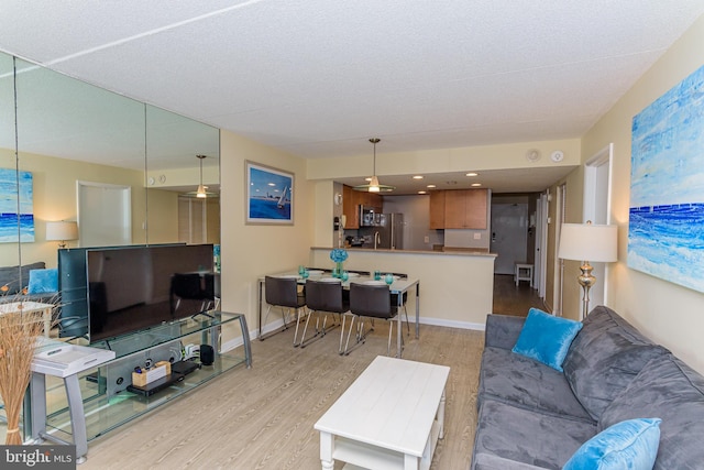 11500 Coastal Hwy Unit 317, Ocean City, MD 21842 - living room featuring wood finished floors and baseboards