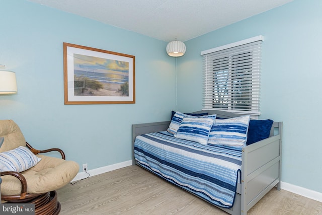 11500 Coastal Hwy Unit 317, Ocean City, MD 21842 - bedroom with light wood finished floors and baseboards