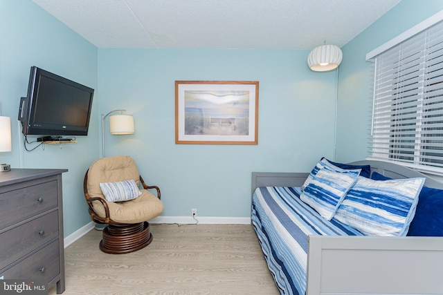 11500 Coastal Hwy Unit 317, Ocean City, MD 21842 - bedroom with light wood-style flooring and baseboards